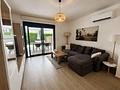 Moderne Erdgeschoss-Wohnung mit 3 Schlafzimmern, 2 Bädern, privatem Garten und Gemeinschaftspool