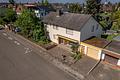 EINFAMILIENHAUS mit kleinem LADENGESCHÄFT und zusätzlichem BAUPLATZ - Frontansicht