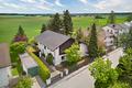 Mit freiem Blick ins Grüne: Einfamilienhaus mit Einliegerwohnung und Garten - Domizil in grüner Toplage