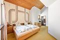 Stadtnah und direkt am Park! Familienheim mit spannender Architektur, 7 Zimmern und Garten - Schlafzimmer mit En-suite-Bad