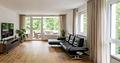Exklusive 3,5-Zimmer-Wohnung mit Design-Ausstattung & urbanem Wohngefühl - Wohnzimmer