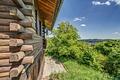 Charmantes Blockhaus in Spiegelberg: Auszeit, Weitblick und Natur pur auf großem Grundstück erleben! - Seitenansicht