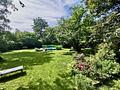 Vermietetes Wohnhaus mit Nießbrauch im Villenviertel Planeggs - Gartenansicht mit Pool