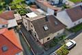 Doppelhaushälfte als Ein- oder Zweifamilienhaus mit Garage und sonnigem Garten - Luftaufnahme