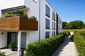 Neuwertige und offen gestaltete 2-Zimmer-EG-Wohnung mit schöner Terrasse - Eingangsseite