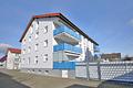 Herrlich große und helle Maisonette-Wohnung mit Balkon, Carport und Garage - Haus Rückseite