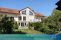 Ein familienfreundliches Haus mit außergewöhnlichem Grünblick, Garten und 2 TG-Plätze - nahe München - FINESTEP Immobilien