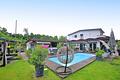 Mehrfamilienhaus-Ensemble mit 7 Wohnungen, Pools, Whirlpool & Outdoor-Küche in Bad Bellingen - Garten mit Außenpool
