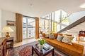 Lichtfülle über den Dächern der Stadt: Loftartige Maisonette mit Dachterrasse - Großzügiges Wohnzimmer 