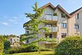Moderne 4-Zimmer-Wohnung mit zwei Balkonen, Klimaanlage, Tiefgaragenstellplatz und Gartennutzung - Hausansicht