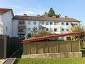 Gepflegte 2-Zimmer-Erdgeschosswohnung mit Terrasse in Traunreut - Hausansicht