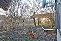 Massives, sanierungsbedürftiges Zweifamilienhaus mit 192 qm Wohnfläche in ruhiger Wohnlage - Garten vor Terrasse