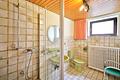 Einfamilienhaus im Bungalow-Stil mit Wintergarten auf großem Grundstück in sehr ruhiger Ortsrandlage - UG Bad