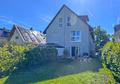 Solln: Moderne Doppelhaushälfte mit schönem Westgarten und Carport - Gartenansicht