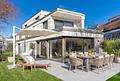 Erstbezug: Großzügige 4-Zimmer-Gartenwohnung mit Hobbyraum und privatem Haus-im-Haus-Gefühl - Outdoor-Refugium (KI bearbeitet)