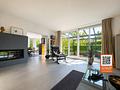 Provisionsfrei! Exklusives Einfamilienhaus mit stilvollem Design und idyllischem Garten - Wohnbereich mit Kamin