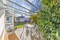 Verlieben erlaubt: Das Haus in Ottobrunn, das Ihre Checkliste tanzen lässt. - überdachte Terrasse zur Küche 