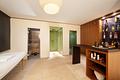 Moderne Architektenvilla mit exklusivem Interior-Konzept, Lift, Spa-Lounge, Home-Gym und Outdoorpool - Wellnessbereich mit Bar
