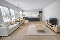 Großzügiger 144m² Winkelwalmdachbungalow * Energieeffizienzhaus Kfw 55 - Wohnzimmer mit offener Küche Einrichtungsbeispiel