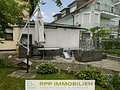 Attraktives Dreifamilienhaus mit stabilem Vermietungspotenzial und Entwicklungschancen - Terrasse Garagenrückseite