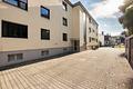 Bezugsfreie 1-Zimmer-ETW in Rosenheim / Happing - Hausansicht Garagenseite