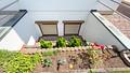 Herrliche Gartenwohnung mit Südloggia | großer Hobby-/Büroraum mit Duschbad | Carport - Abböschung