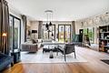 Haus-im-Haus: Großzügiges Domizil in stylischer Design-Ästhetik mit sonnigem Garten - Weitläufiger Livingbereich