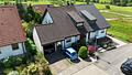 Familienglück mit Einliegerwohnung, Südterrasse, Garten und Garage - Hausansicht