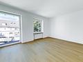 Frisch sanierte 2-Zimmer-Wohnung mit Balkon in zentraler Lage von Freilassing - Wohnzimmer