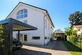 Moderne Doppelhaushälfte mit Garten, Carport und Wärmepumpe in ruhiger naturnaher Wohnlage - Front