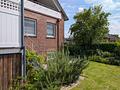 Gelegenheit für Mehrgenerationen-Wohnen oder großzügige Eigennutzung: Haus mit 7+4 Zimmern in Varel - Gartenansicht