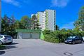 Erbpacht: Vermietete 3-Zimmer-Wohnung mit Balkon und Tiefgaragenstellplatz in Unterschleißheim - Gebäude mit Tiefgaragenzufahrt