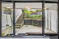Toller Split-Level-Atrium Bungalow mit 3 Garagenstellplätzen I 10 Jahre Wohnrecht für Verkäufer - Terrassenbereich im UG
