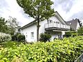 Freistehendes Ein-/ Zweifamilienhaus auf sonnigem Gartengrundstück mit viel Potenzial in Ottobrunn - Blick auf Haus