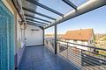 Reihenendhaus mit 6 Zimmern, zwei Balkonen & PV-Anlage – flexibel nutzbar und sofort bezugsfrei - Balkon EG
