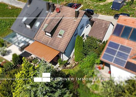 Familienglück mit Einliegerwohnung, Südterrasse, Garten und Garage - Hausansicht