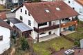 Charmante Doppelhaushälfte mit viel Platz für die Familie – Balkon, Garten & Garage - Rückansicht