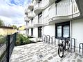 Kapitalanlage - Vermietetes Apartment mit Terrasse  im Studentenwohnheim - Aussenansicht-Innenhof