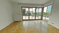 Charmante 3-Zimmer-Erdgeschosswohnung mit Terrasse & Garten in ruhiger Zentrumslage von Freilassing - Wohnzimmer