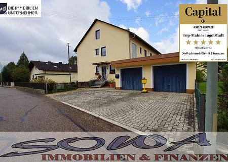 Attraktives Zweifamilienhaus mit zwei Garagen aus einem großzügigen Grundstück - Ein Objekt von Ihrem Immobilienpartner SOWA Immobilien und Finanzen