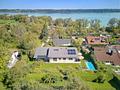 Familienvilla mit Pool, luftigem Strandhausflair, Seeblick, Lift und Einliegerwohnung in Seenähe - Attraktives Familiendomizil