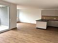 HEGERICH: Wohnträume werden wahr – Stilvolle Neubauwohnung mit sonnigem Balkon - Wohnzimmer mit Küche