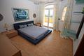 Erstklassige Villa mit Infinity-Pool, Barbecue, Spielplatz, Doppelgarage, Keller, Garten, Balkon, Terrasse, viele Details, auf der Südseite von Montgó