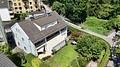 Interessantes Mehrfamilienhaus mit 6 Wohneinheiten und großem Grundstück in Rosenheim! - Blick zum Haus