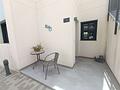Moderne Erdgeschoss-Wohnung mit 3 Schlafzimmern, 2 Bädern, privatem Garten und Gemeinschaftspool
