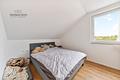 Jung. Modern. Energieeffizient. – Dachgeschosswohnung mit Balkon & Stellplatz - Schlafzimmer