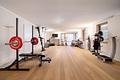 Moderne Architektenvilla mit exklusivem Interior-Konzept, Lift, Spa-Lounge, Home-Gym und Outdoorpool - Großes Home-Gym mit Lichthof