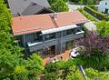 Architektonisches Juwel:
Einfamilienhaus mit hochwertiger Ausstattung
- sehr viel Privatsphäre - Gartenansicht