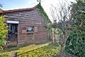 Familientraum in ruhiger Lage: Doppelhaushälfte mit Sonnengarten & Garage - renovierungsbedürftig - Gartenhütte