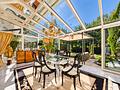 Walmdach-Einfamilienhaus mit schönem Garten, Wintergarten & vielseitigem Souterrain am Isarhochufer - Wintergarten